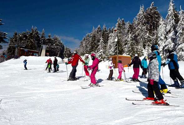 On the top of a blue slope